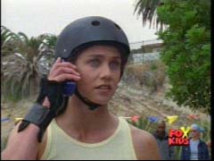Kelsey Winslow (Yellow Ranger) gets a call while rollar blading